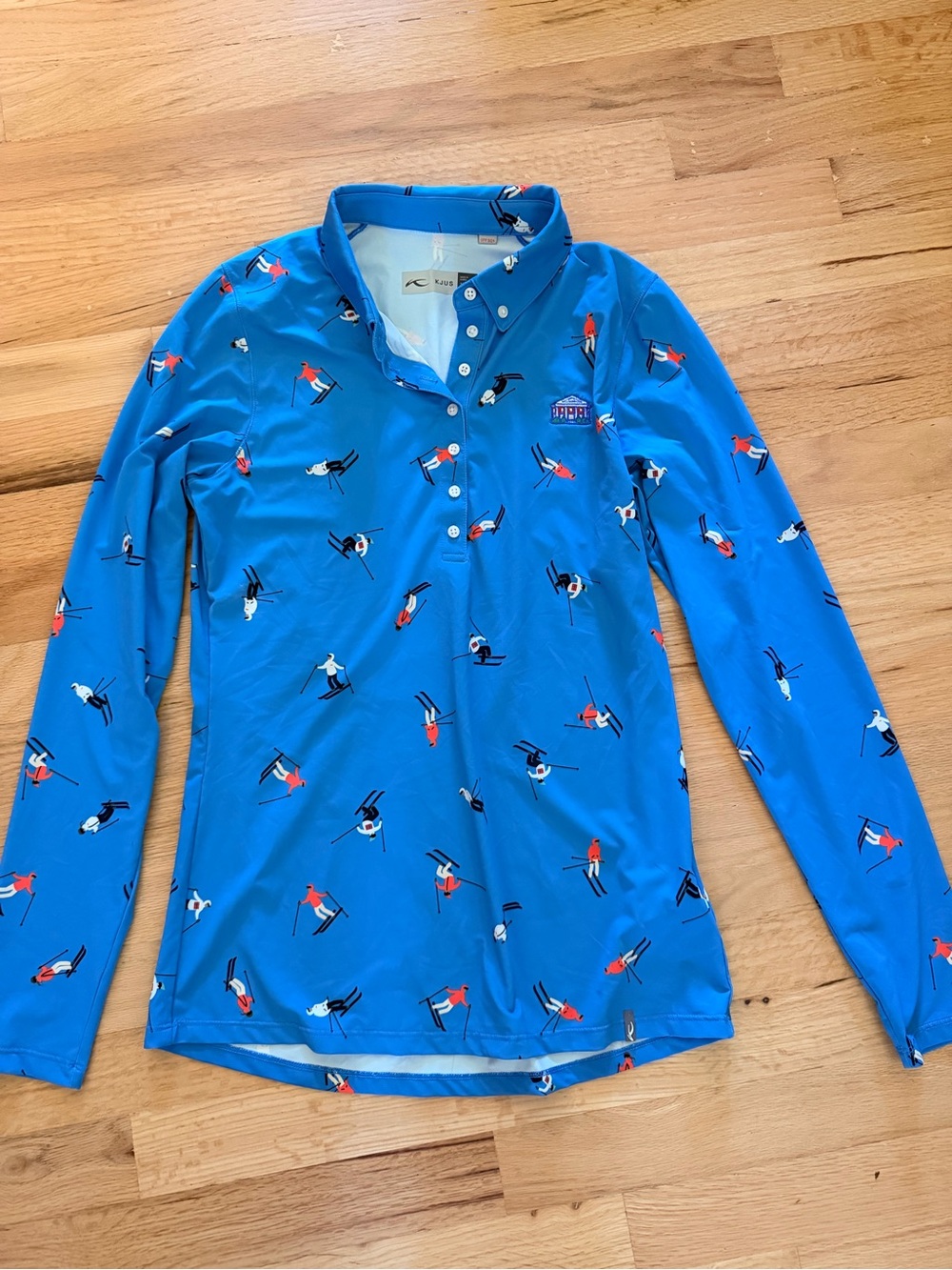 Women’s Bright Blue Long-Sleeve Ski Polo with Allover Skier Print